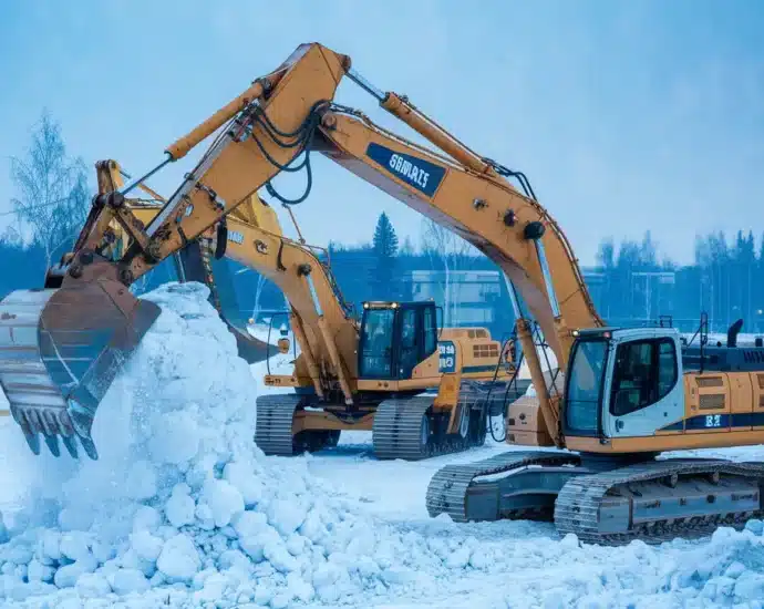 Ekstreme forhold anleggsmaskiner fungerer under harde vaerforhold featured